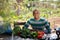 Professional gardener resting after harvesting of vegetables