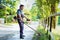 Professional gardener using an edge trimmer in home garden