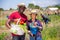 Professional gardeners posing with harvest of vegetables