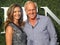 Professional golfer and entrepreneur Greg Norman and Kirsten Kutner on the blue carpet before US Open 2017 opening night ceremony