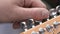 Professional Guitarist Tuning Electric Guitar At Studio. Close Up