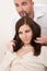 Professional hairdresser comb customer at salon