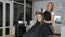 Professional hairdresser stylist curling up teen girl hair
