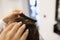 Professional hairdresser use comb for creating stylish haircut