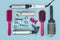 Professional hairdressing tools on blue background, view from above