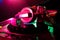 Professional headphones and mixer DJ for music in nightclub on background color lasers