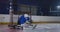 Professional hockey, goalkeeper catches the puck after hitting a player in a hockey match