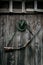 Professional hunters equipment for hunting. Rifle, hat, bag and others on a wooden black background.