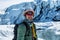 Professional ice climbing guide in front of the icefall of the Matauska Glacier