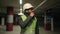 Professional industry engineer Indian Arabian man in glasses bearded male builder in safety uniform hard hat walk at