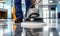 Professional janitorial staff using an industrial floor buffer machine for cleaning and polishing the hallway of a modern