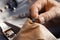 Professional jeweler working with ring, closeup view