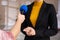 Professional journalist interviewing young woman in room