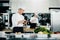 Professional kitchen of a restaurant, a male chef checks the availability of products from an employee. Restaurant warehouse