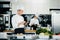 Professional kitchen of a restaurant, a male chef checks the availability of products from an employee. Restaurant warehouse