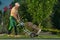 Professional Landscaper Moving Grass Turfs on a Cart