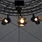 Professional lighting equipment near ceiling of theater stage.