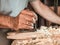 Professional luthier violinmaker artisan working on making a handmade violin with ancient tradtitional Stradivarius craftmanship