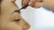 Professional makeup mascara application with brush - work in beauty fashion industry cosmetics