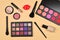 Professional makeup products with cosmetic beauty products, foundation, lipstick,  eye shadows, eye lashes, brushes and tools