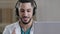 Professional male arab young doctor medical assistant in medical coat wear headset with microphone make conference call