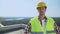 Professional male builder in helmet looking camera, construction industry, work