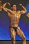 Professional Male Caucasian Bodybuilder Performing on Stage.