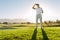 Professional male golfer standing on golf course