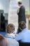 Professional Male Lecturer on Stage in Front of  The Roll-Up Stand During Conference