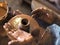 Professional male potter making ceramics on potter`s wheel in workshop, studio. Close up shot of potter`s hands