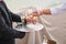 Professional male waiter in uniform serving champagne. Woman taking one glass of champagne. DOF. Natural light. Photo in motion