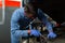 Professional man car mechanician repairing car in auto repair