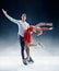 Professional man and woman figure skaters performing on ice show