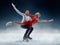 Professional man and woman figure skaters performing on ice show