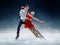 Professional man and woman figure skaters performing on ice show