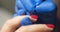 Professional manicurist applies polish to client nails in beauty salon