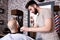 Professional Master hairdresser cuts client beard