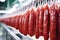 Professional meat production: rows of fresh sausages