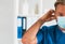 Professional medical doctor in hospital office, Portrait of young and confident physician in protective mask.