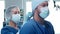 Professional medical doctors working in emergency medicine. Portrait of the surgeon and the nurse in protective masks