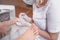 Professional medical pedicure procedure close up using double nail instrument. Patient visiting chiropodist podiatrist. Foot
