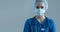 Professional medical worker in protection suit. Nurse, surgeon, doctor or paramedic in blue uniform. Emergency medicine