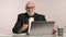 Professional Middle-Aged Man in Tuxedo and Bow Tie Working in Bright Office