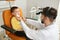 Professional otolaryngologist examining little boy