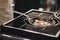 Professional outdoor grill. Close-up of male chef preparing T-bone steak on frying pan