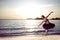 Professional Passionate And Sensual Japanese Ballet Dancer in Black Tutu And Silver Crown Posing Near Seashore During Ballet Pas