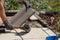 A professional paver worker laying patio slabs in a gravel bed using a professional paving hammer. Equipment from a bricklayer for