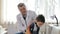 Professional pediatrician, conducts a medical examination of the child