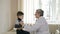 Professional pediatrician, conducts a medical examination of the child