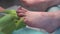 A professional pedicurist performs the procedure for removing old toenails. Girl in salon close-up.